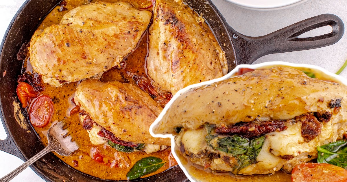 The sun-dried tomato stuffed chicken with a juicy filling, served in a pan with rich, golden sauce and garnished with tomatoes.