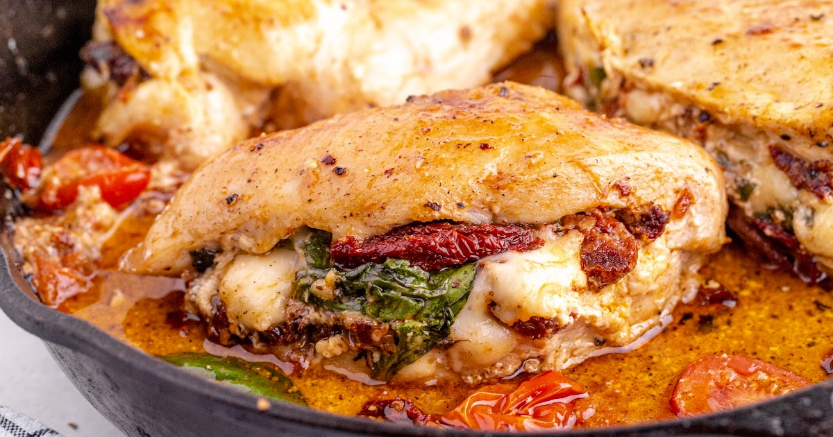 A beautifully plated stuffed chicken breast with a burst of flavors from the sun-dried tomatoes, spinach, and cheese.