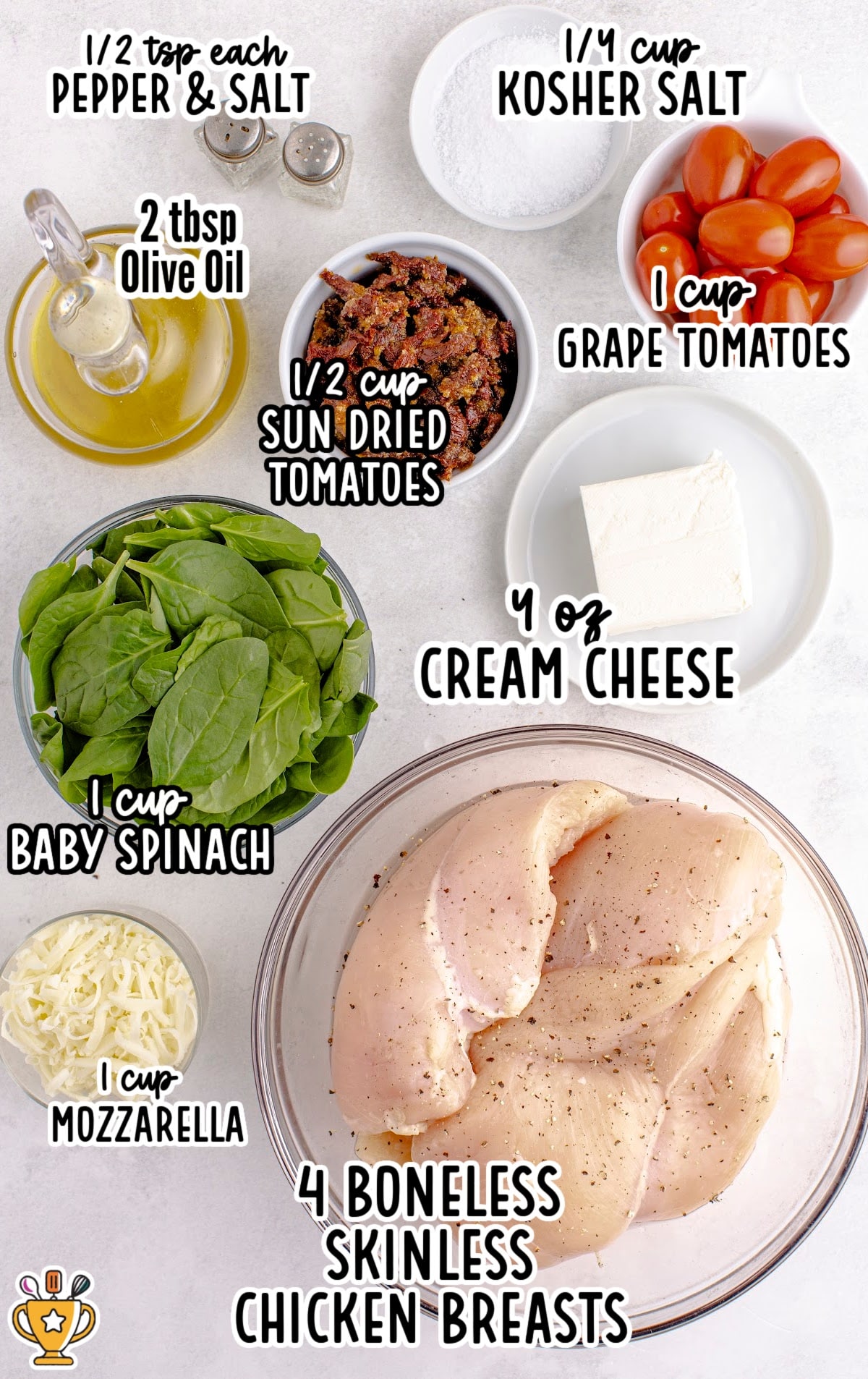 Ingredients for the stuffed chicken: chicken breasts, spinach, sun-dried tomatoes, mozzarella, cream cheese, and grape tomatoes in bowls.