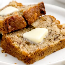 two slices of Air Fryer Banana Bread on a plate