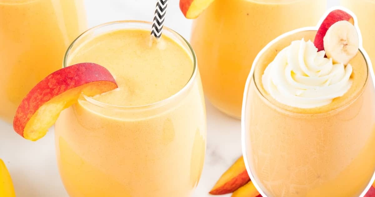 Glass of peach banana smoothie with peach slice and straw beside another smoothie topped with whipped cream and fruit. Surrounded by peaches and bananas.