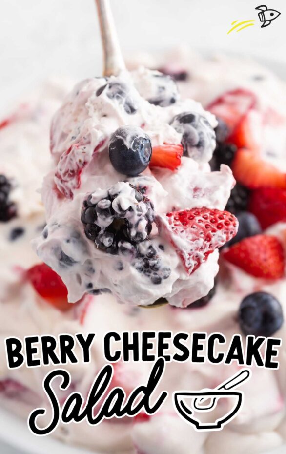 Mixed berry cheesecake salad with blueberries, raspberries, and strawberries folded into a fluffy cream cheese base