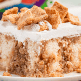 A piece of Cinnamon Toast Crunch Poke Cake