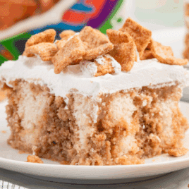 A piece of Cinnamon Toast Crunch Poke Cake