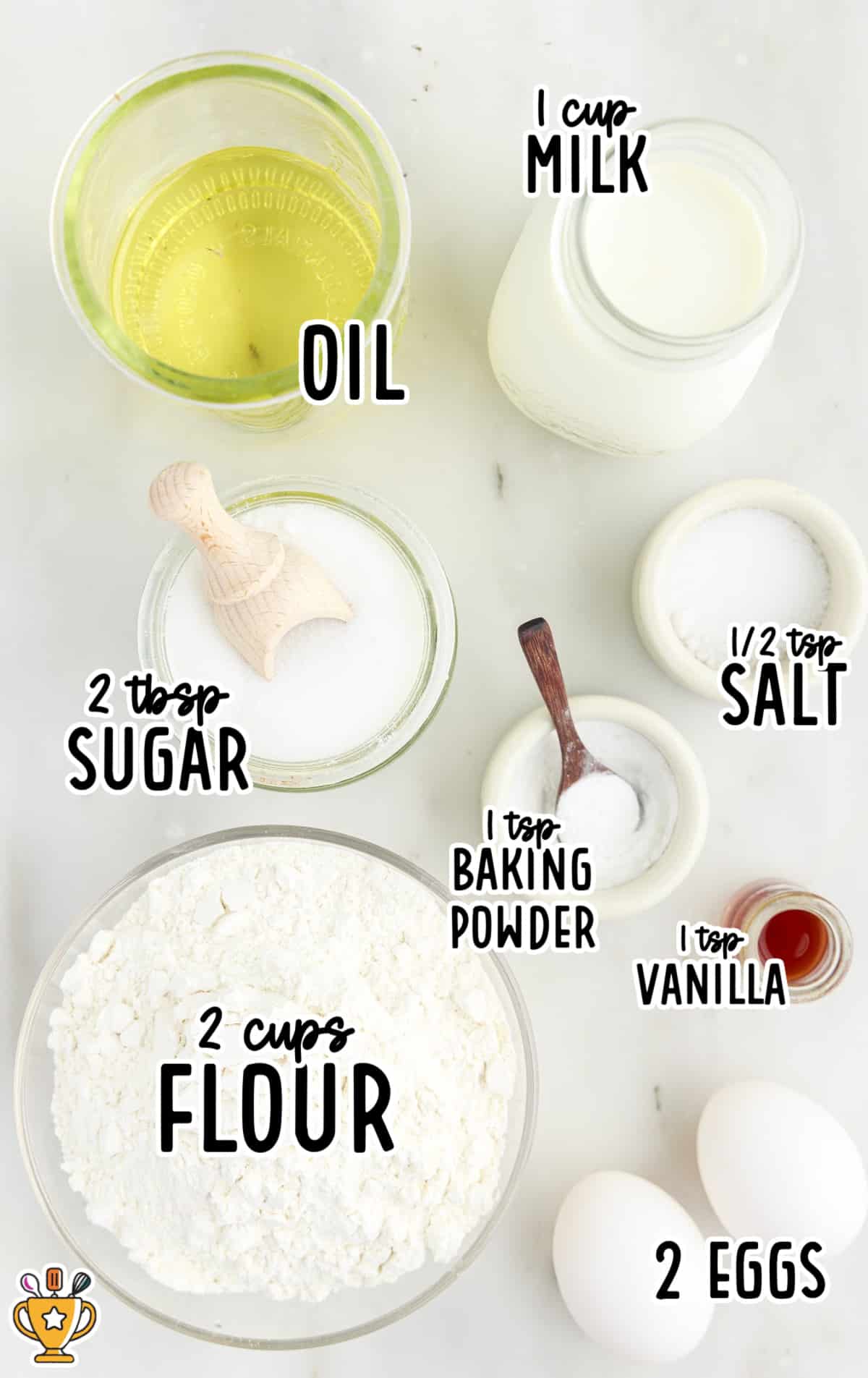 Flat lay of labeled ingredients for funnel cake fries including flour, eggs, sugar, vanilla, baking powder, milk, salt, and oil.