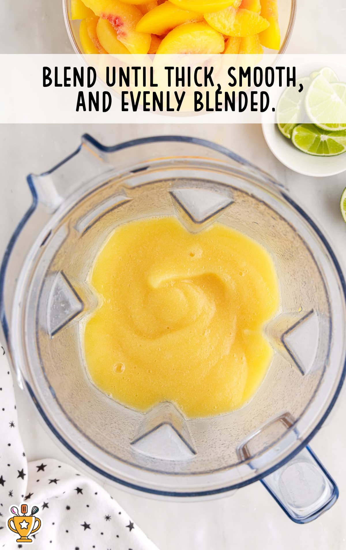 blending peach margarita in a blender