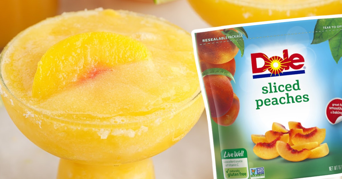 Bright and refreshing peach margarita served over ice in a cocktail glass