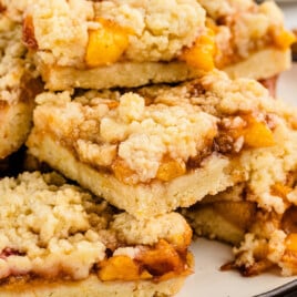 a plate full of Peach Bars on a plate