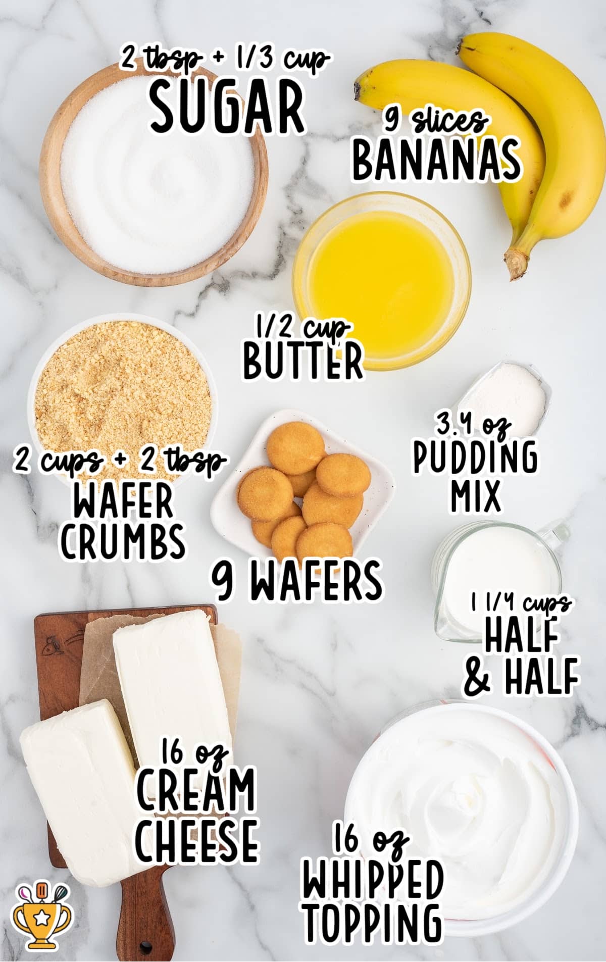 Overhead photo of measured ingredients for banana cheesecake bars, including bananas, cream cheese, pudding mix, whipped topping, sugar, butter, and wafers.