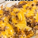 Glass baking dish of cheesy hamburger potato casserole with golden layers of beef, potatoes, and melted cheese, labeled as the best casserole.