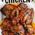 Huli Huli chicken glazed with a tangy sweet marinade, topped with green onions and served with grilled pineapple and white rice.”