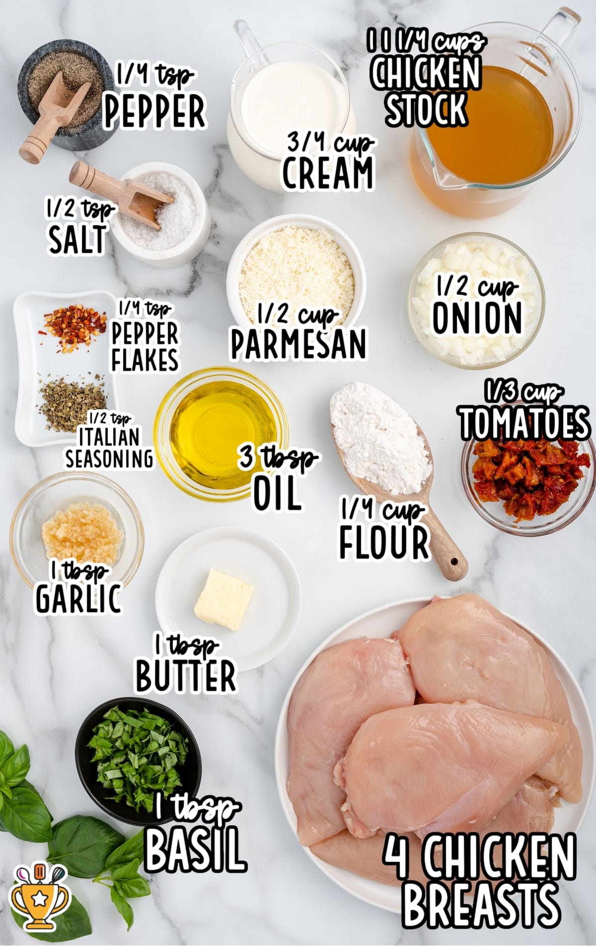 Flat lay of Marry Me Chicken ingredients including chicken breasts, cream, Parmesan, tomatoes, basil, garlic, onion, stock, and seasonings.