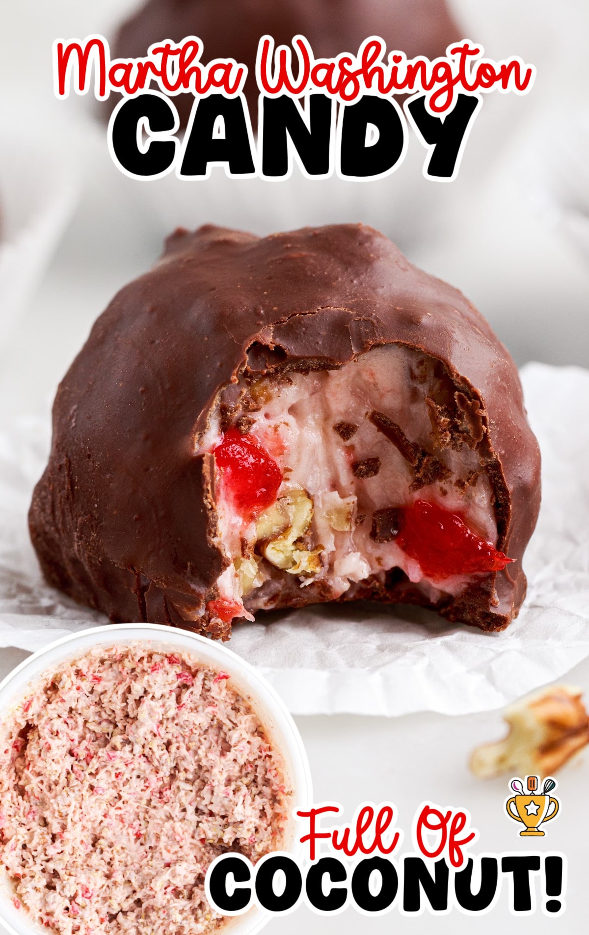 Martha Washington candy sitting in a white paper liner, shown with a bite taken out to display the creamy center and vibrant cherries.
