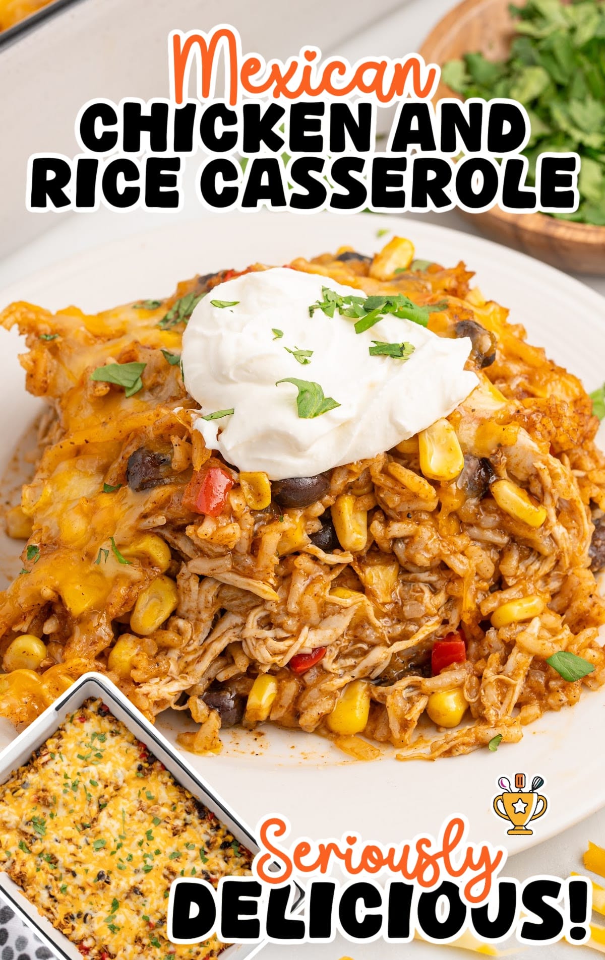 Serving of cheesy Mexican chicken and rice casserole topped with sour cream and cilantro, made with shredded chicken, black beans, corn, and peppers.