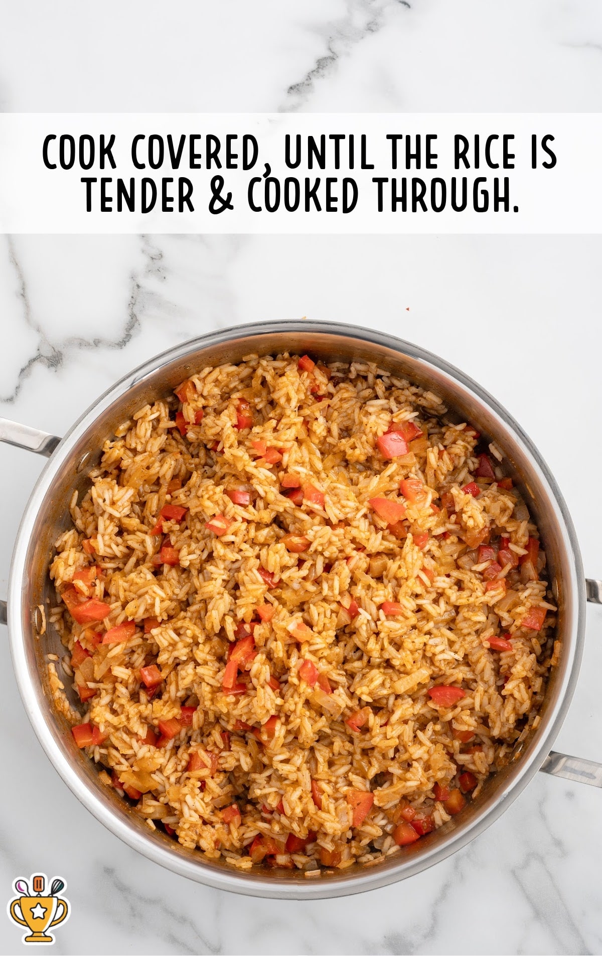 Jasmine rice simmering with peppers and seasonings in a skillet until tender, step for making easy Mexican chicken and rice casserole.