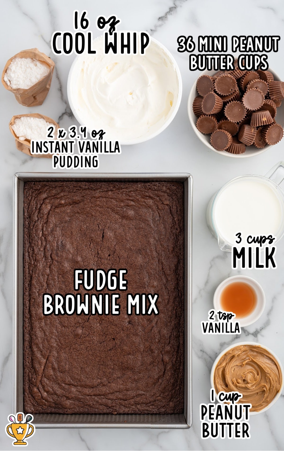 Overhead shot of all the dessert ingredients including baked fudge brownies, Cool Whip, instant vanilla pudding, peanut butter, milk, vanilla, and mini peanut butter cups.