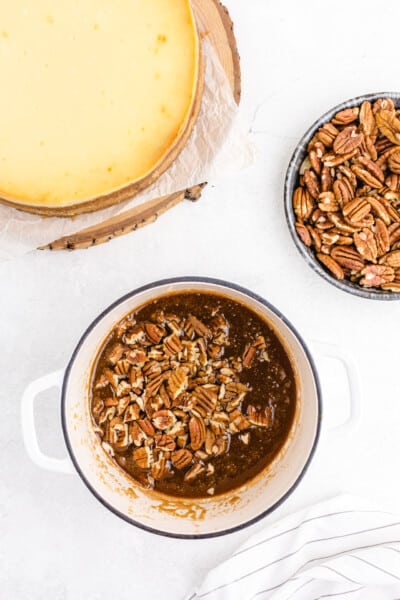Remove from heat and stir in vanilla extract and heavy cream. Whisk until smooth.