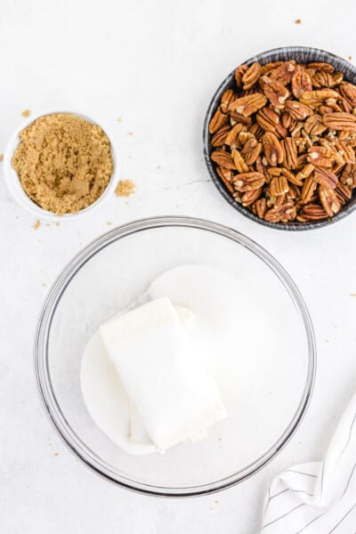 Beat together cream cheese and sugar until fully mixed and fluffy.