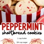 Close-up of a Christmas tin filled with peppermint shortbread cookies and Andes peppermint crunch candies, paired with a tied stack of cookies wrapped in red-and-white twine, with bold text reading “buttery & delicious peppermint shortbread recipe” and “so easy to make for holidays & parties.”
