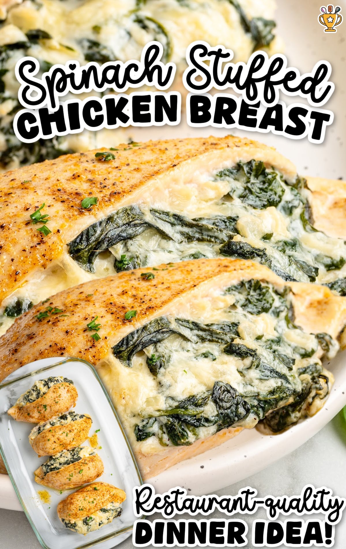 Overhead view of golden spinach stuffed chicken breasts with rich, cheesy spinach filling oozing out for a restaurant-quality dinner idea.