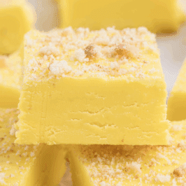 Creamy yellow banana fudge squares topped with crushed vanilla wafer crumbs.