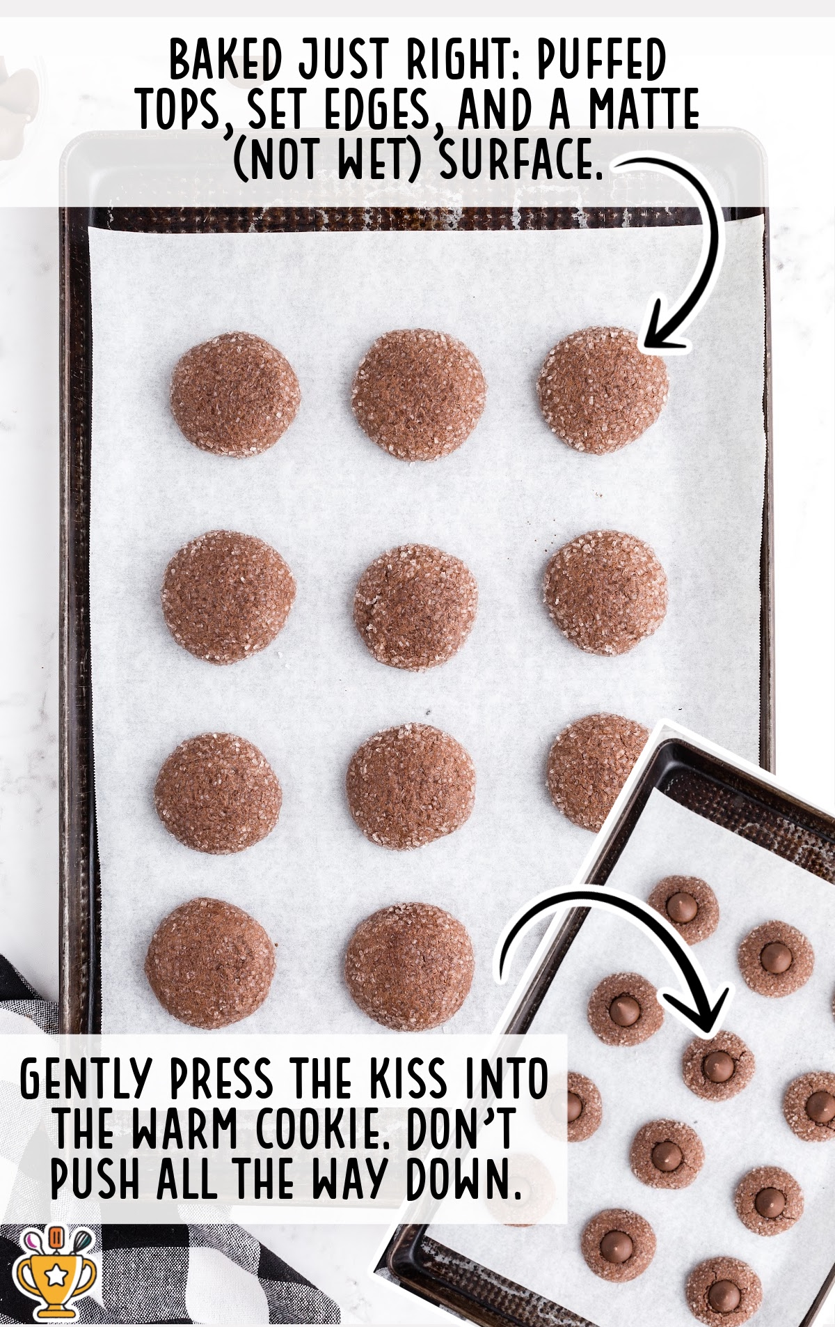 Baked chocolate sugar cookies on a parchment-lined baking sheet showing puffed tops and matte surfaces, alongside an inset image of Hershey’s Kisses being gently pressed into warm cookies, with instructional text explaining the timing.