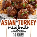 Asian turkey meatballs stacked on a plate with brown rice and broccoli, coated in a rich, shiny sauce and garnished with sesame seeds and green onions.