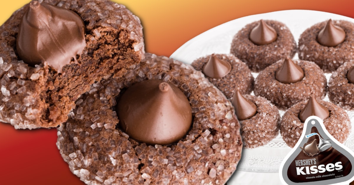 Soft chocolate kiss cookies with a sugar-coated exterior and Hershey’s Kisses on top, showing a puffy cookie interior that holds its shape.