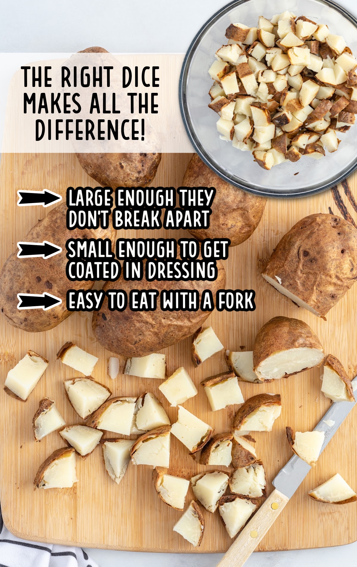 Baked potatoes diced into fork-sized pieces on a cutting board, showing the ideal size for mixing into loaded baked potato salad without breaking apart.