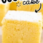 Pinterest pin showing a close-up square of Lemon Custard Cake with a dusting of powdered sugar and visible custard layer; text reads “EASY LEMON CUSTARD cake” with an arrow pointing to the cake and “Vintage Recipe!” at the bottom, plus a small “BEST BLOG RECIPES” logo in the top left.