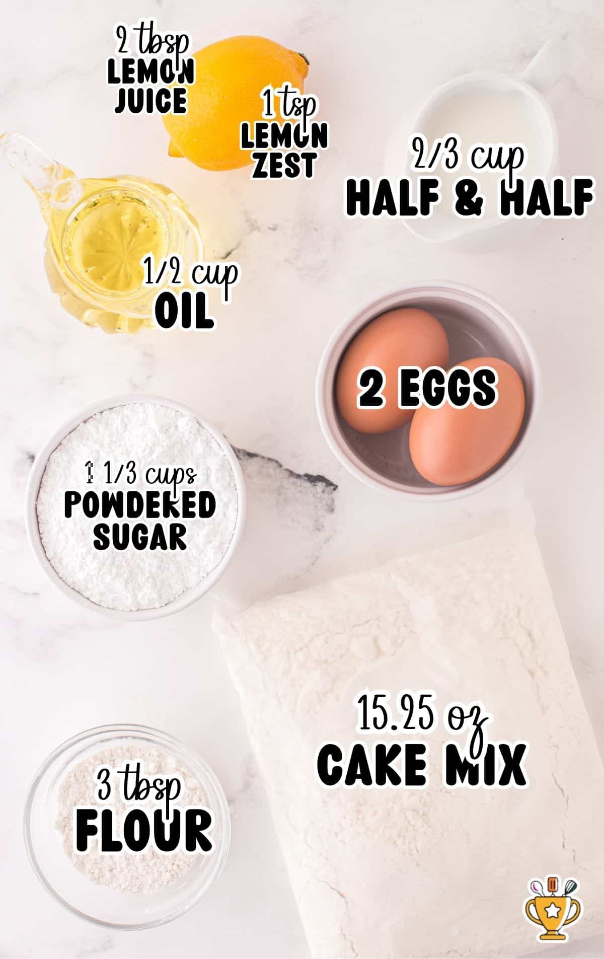 Overhead view of labeled ingredients for Cake Mix Muffins including 15.25 oz cake mix, 1 ⅓ cups powdered sugar, 2 tbsp lemon juice, 1 tsp lemon zest, ⅔ cup half & half, ½ cup oil, 2 eggs, and 3 tbsp flour arranged on a white marble surface.