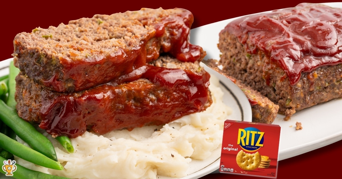 Horizontal image showing two thick slices of Cracker Barrel–style meatloaf stacked on a plate over creamy mashed potatoes, coated with a glossy red ketchup glaze. The sliced interior appears tender with visible bits of onion and green bell pepper. Bright green beans sit alongside the meatloaf, and a second portion of glazed meatloaf rests on a white platter in the background. A box of Ritz crackers appears in the lower right corner, highlighting the use of crushed Ritz crackers in the recipe.