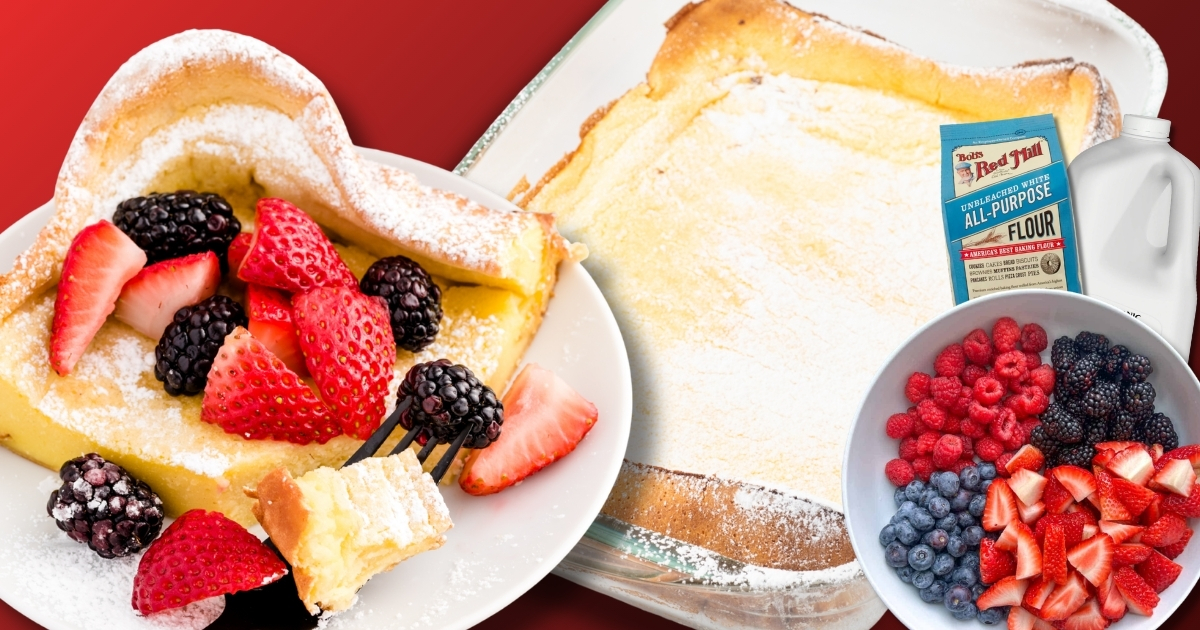 Wide Facebook banner showing a light, puffy dutch baby in a glass baking dish dusted with powdered sugar, plus a plated slice topped with strawberries and blackberries;