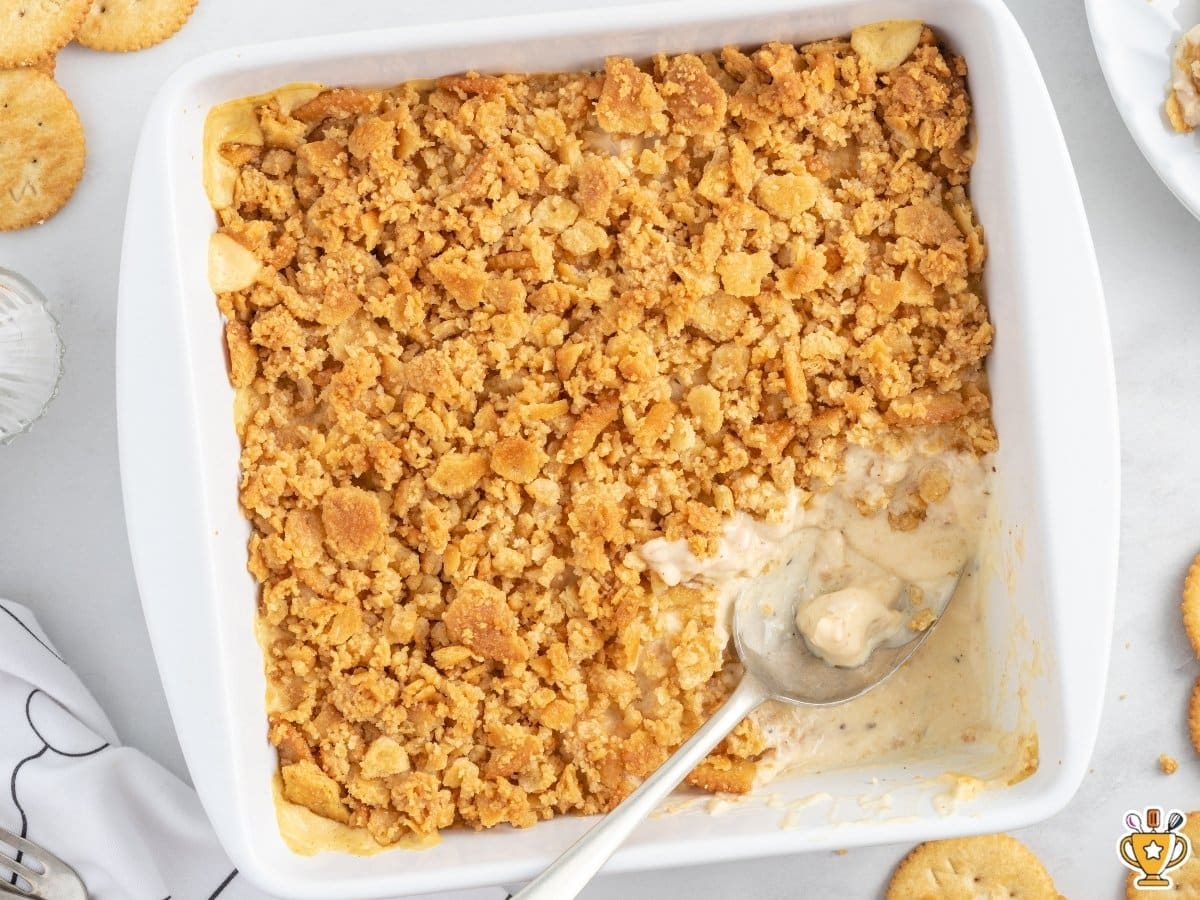 Ritz Cracker Chicken Casserole baked in a white casserole dish with a creamy chicken filling and a golden buttery Ritz cracker topping.