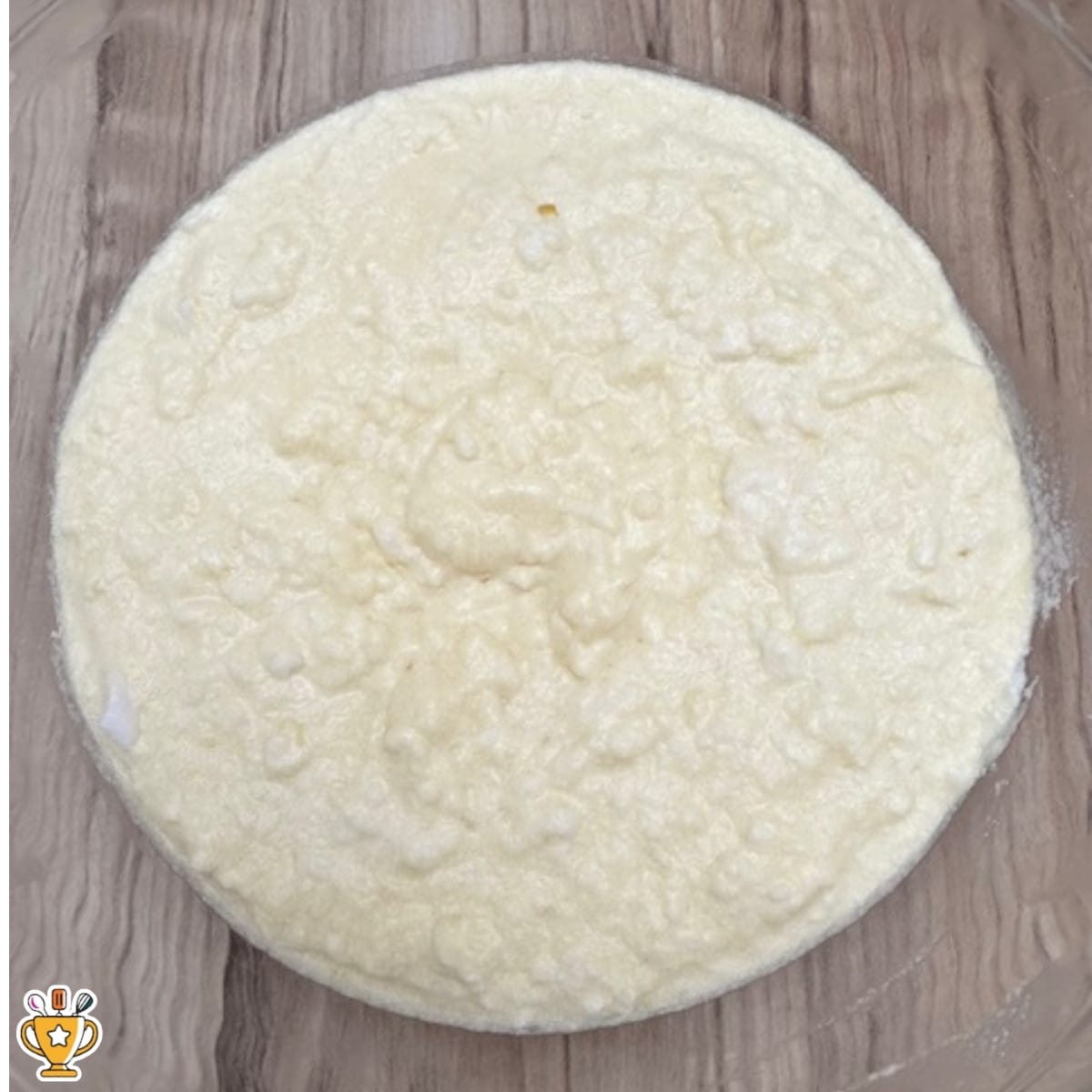 thin lemon custard cake batter with visible egg white lumps before baking
