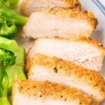 Pinterest graphic showing sliced Parmesan crusted pork chops with broccoli on a plate. On-image text says “PARMESAN CRUSTED PORK CHOPS,” “Ultra Juicy Recipe!,” and “50-minute FAMILY DINNER.”