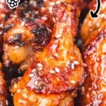 Close-up of air fryer honey garlic chicken wings with text overlay reading “AIR FRYER HONEY GARLIC CHICKEN RECIPE” and “COATED IN STICKY HOMEMADE SAUCE!” plus an air fryer graphic
