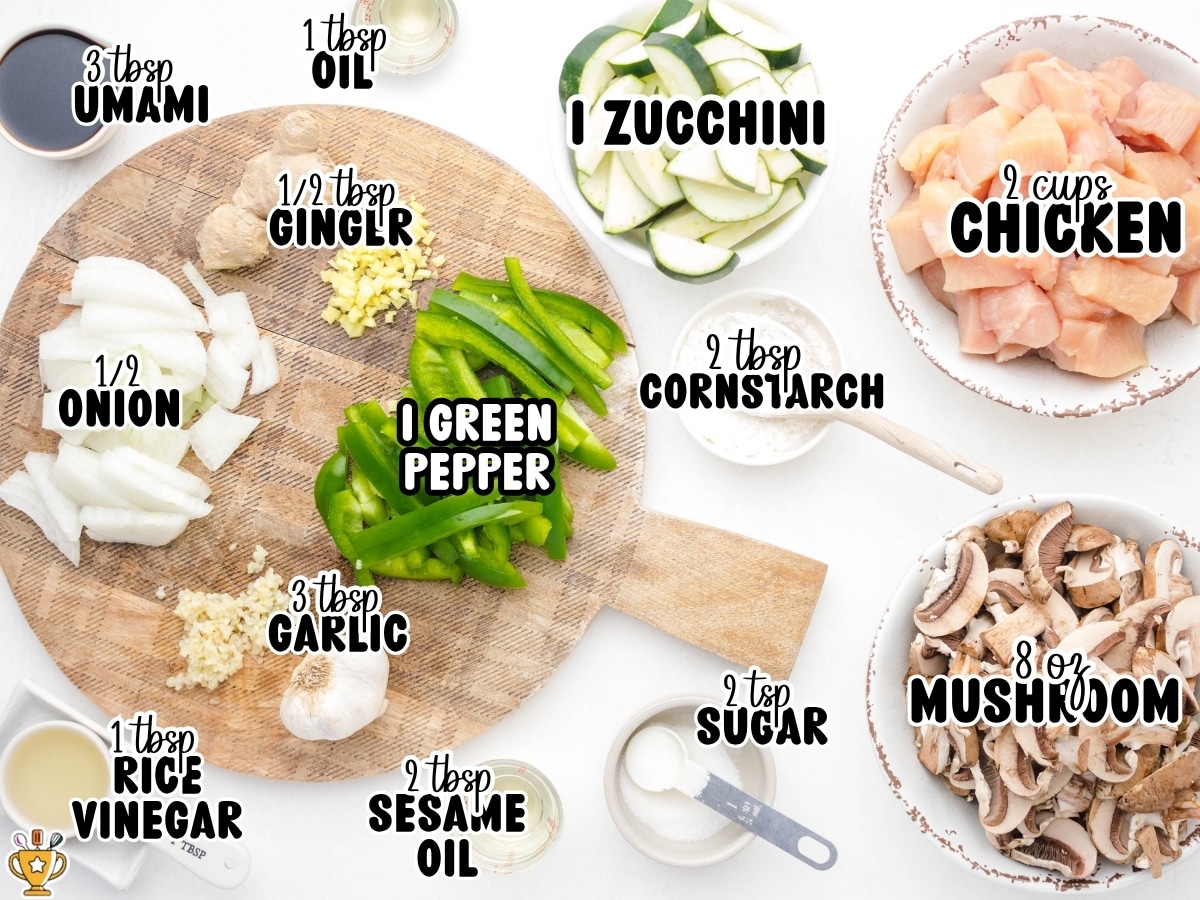Overhead view of ingredients for Panda Express mushroom chicken on a white background, including chicken, mushrooms, zucchini, green pepper, onion, garlic, ginger, cornstarch, sesame oil, oil, rice vinegar, sugar, and umami sauce with labeled text