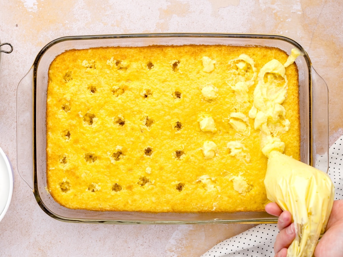 Piping vanilla pudding into evenly spac