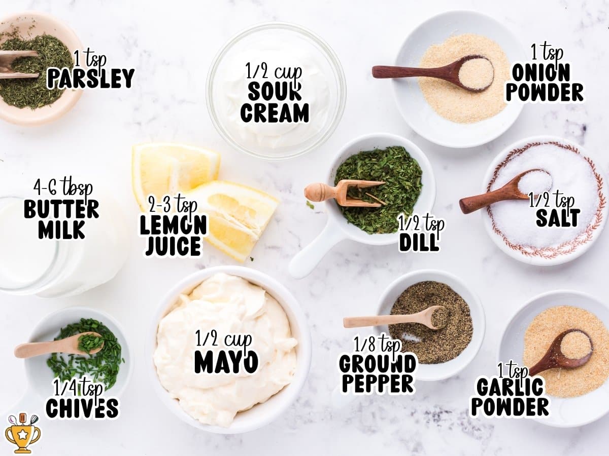 Measured ingredients for homemade ranch dressing arranged on a marble surface, including mayonnaise, sour cream, buttermilk, lemon juice, dried herbs, and seasonings, each labeled with its amount.