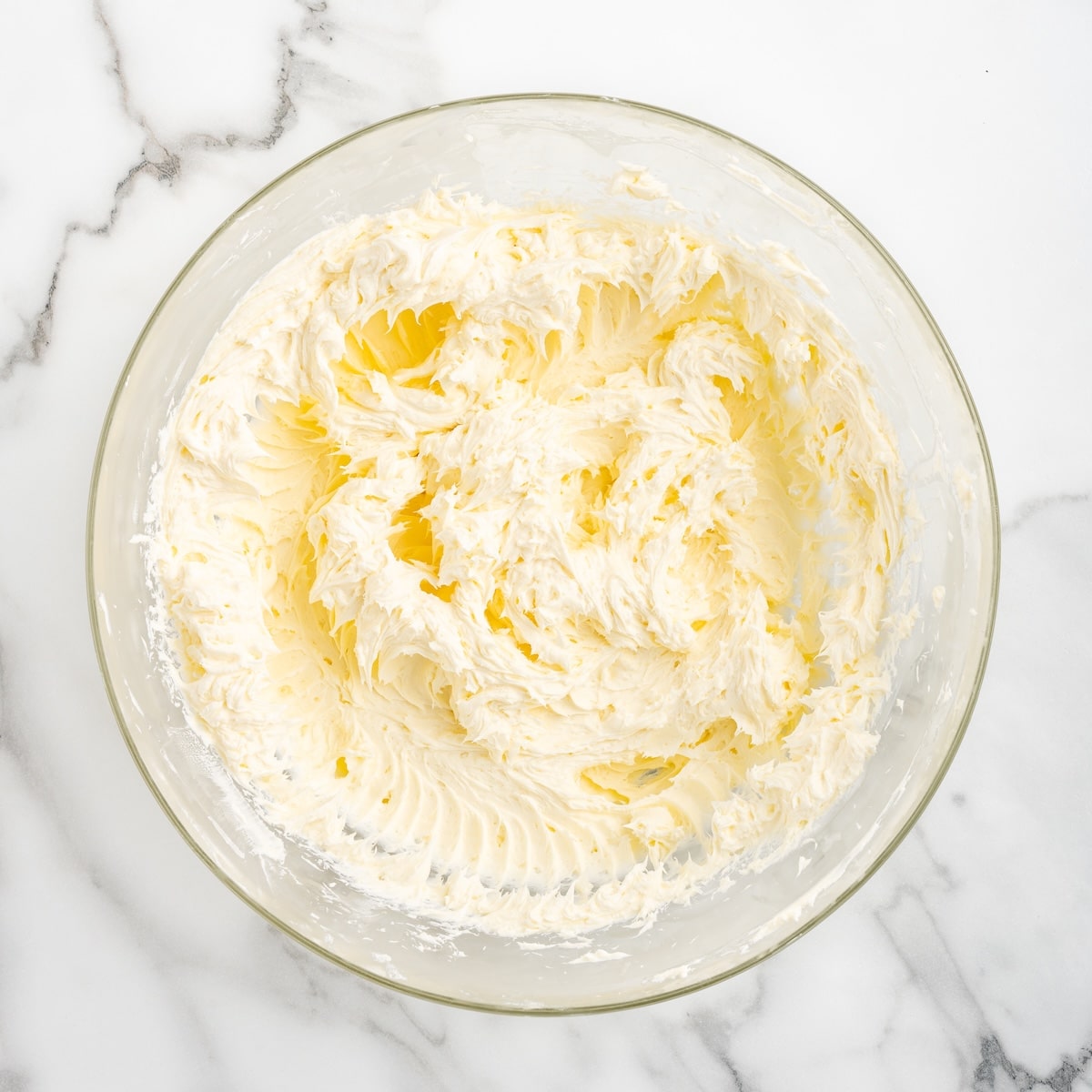 Softened cream cheese and butter beaten together in a glass bowl until smooth and fluffy