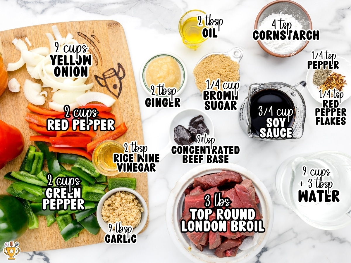 Overhead view of Crock Pot Pepper Steak ingredients on a marble surface, including sliced red and green bell peppers, yellow onion, garlic, ginger, soy sauce, brown sugar, cornstarch, London broil beef, and seasonings with labeled measurements.