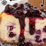 Creamy lemon blueberry cheesecake slice with glossy blueberry topping, bold overlay text reads &ldquo;CREAMY LEMON BLUEBERRY CHEESECAKE&rdquo; and &ldquo;EASY TO MAKE AT HOME!!&rdquo; with decorative elements and logo.