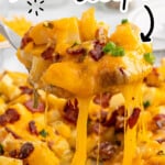Pinterest pin for Mississippi Mud Potatoes recipe with a close-up of cheesy potatoes, bacon, and green onions, plus text that says “MISSISSIPPI MUD POTATOES recipe” and “EASY TO MAKE!!”