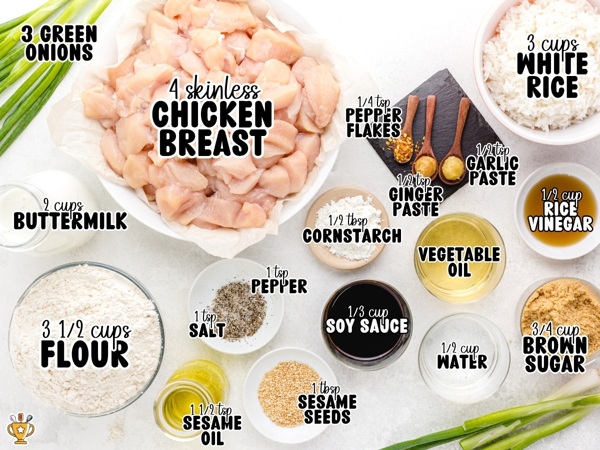 Overhead ingredient photo for sesame chicken with labeled text showing chicken breast, green onions, white rice, buttermilk, flour, soy sauce, brown sugar, rice vinegar, sesame oil, vegetable oil, sesame seeds, cornstarch, garlic paste, ginger paste, red pepper flakes, salt, pepper, and water.