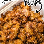 Pinterest graphic for sesame chicken recipe showing crispy glazed sesame chicken over white rice with text that reads “SESAME CHICKEN recipe” and “BETTER THAN TAKEOUT!”