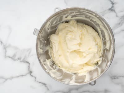 Cream cheese and sugar beaten until smooth and fluffy in a stand mixer bowl.