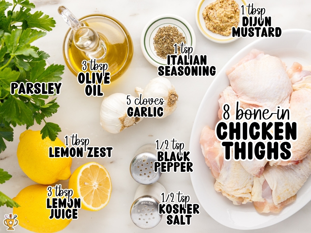 Flat lay of the ingredients needed to make baked chicken thighs, including bone-in chicken thighs, olive oil, Italian seasoning, Dijon mustard, garlic, lemon juice, lemon zest, kosher salt, black pepper, and fresh parsley. The image includes ingredient labels with measurements: "3 tbsp olive oil," "1 tsp Italian seasoning," "1 tbsp Dijon mustard," "5 cloves garlic," "8 bone-in chicken thighs," "1 tbsp lemon zest," "3 tbsp lemon juice," "½ tsp black pepper," and "½ tsp kosher salt."
