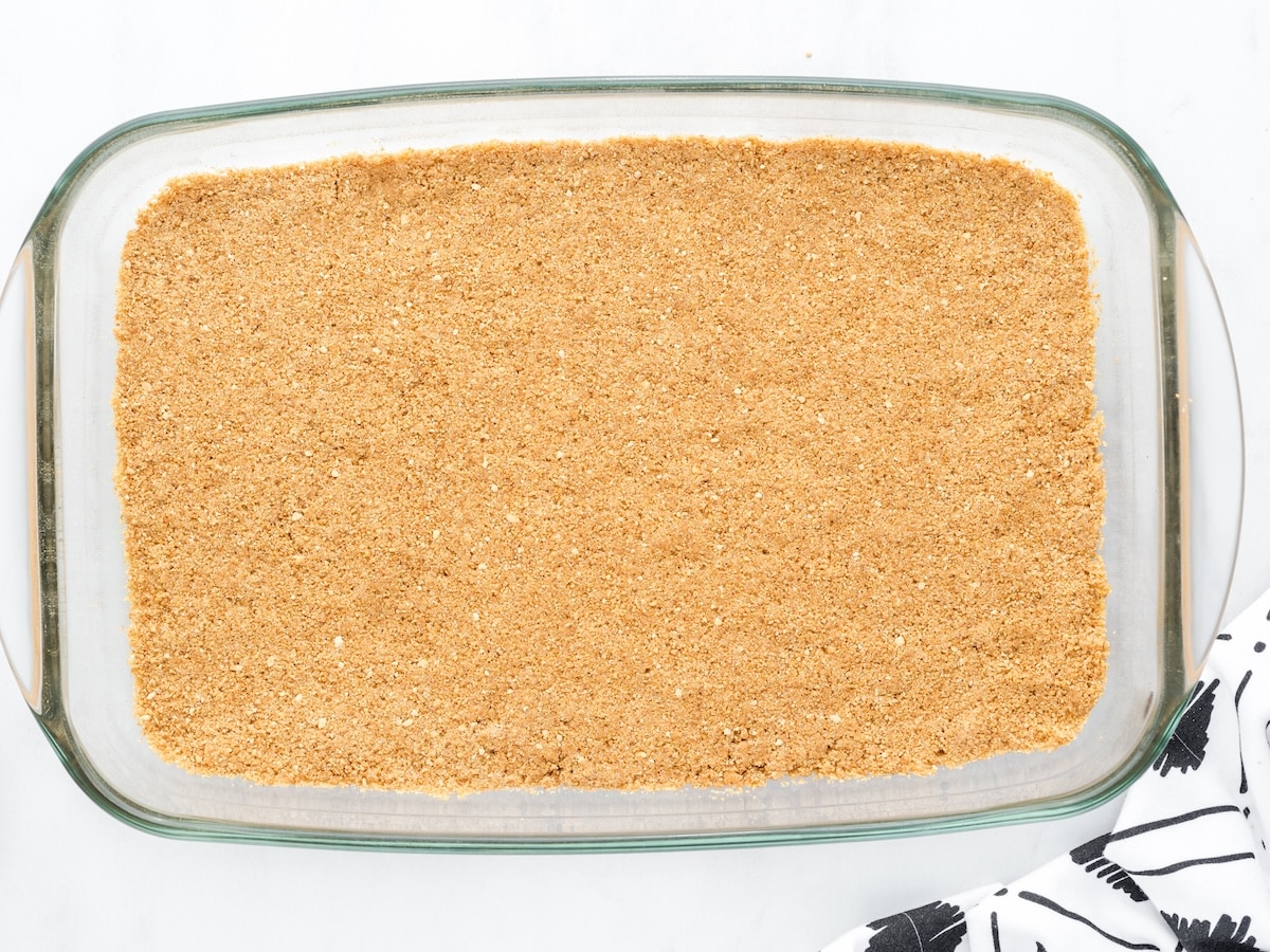 Graham cracker crust pressed into a 9x13 baking dish
