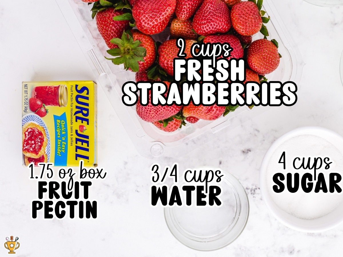 Ingredients for homemade Strawberry Freezer Jam labeled with measurements, including fresh strawberries, Sure-Jell fruit pectin, granulated sugar, and water.